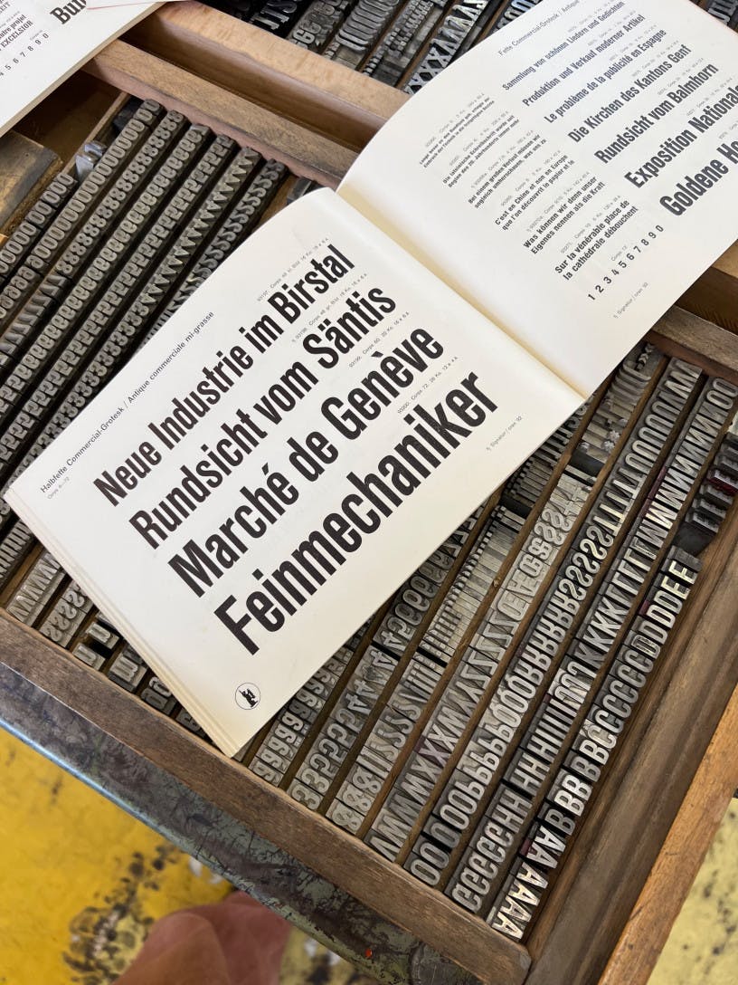Printed typeface specimen of Commercial Grotesk bold on the physical set of metal type.